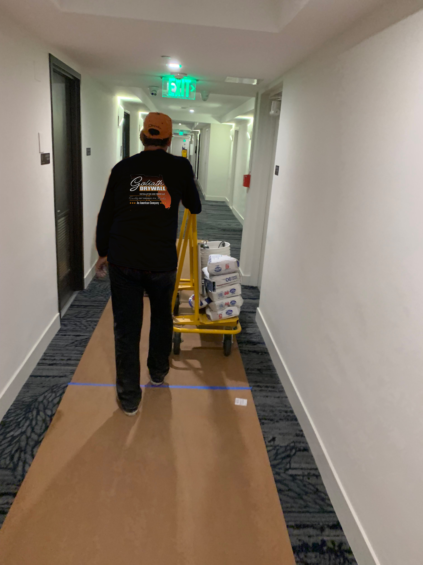 Finisher sanding a smooth wall