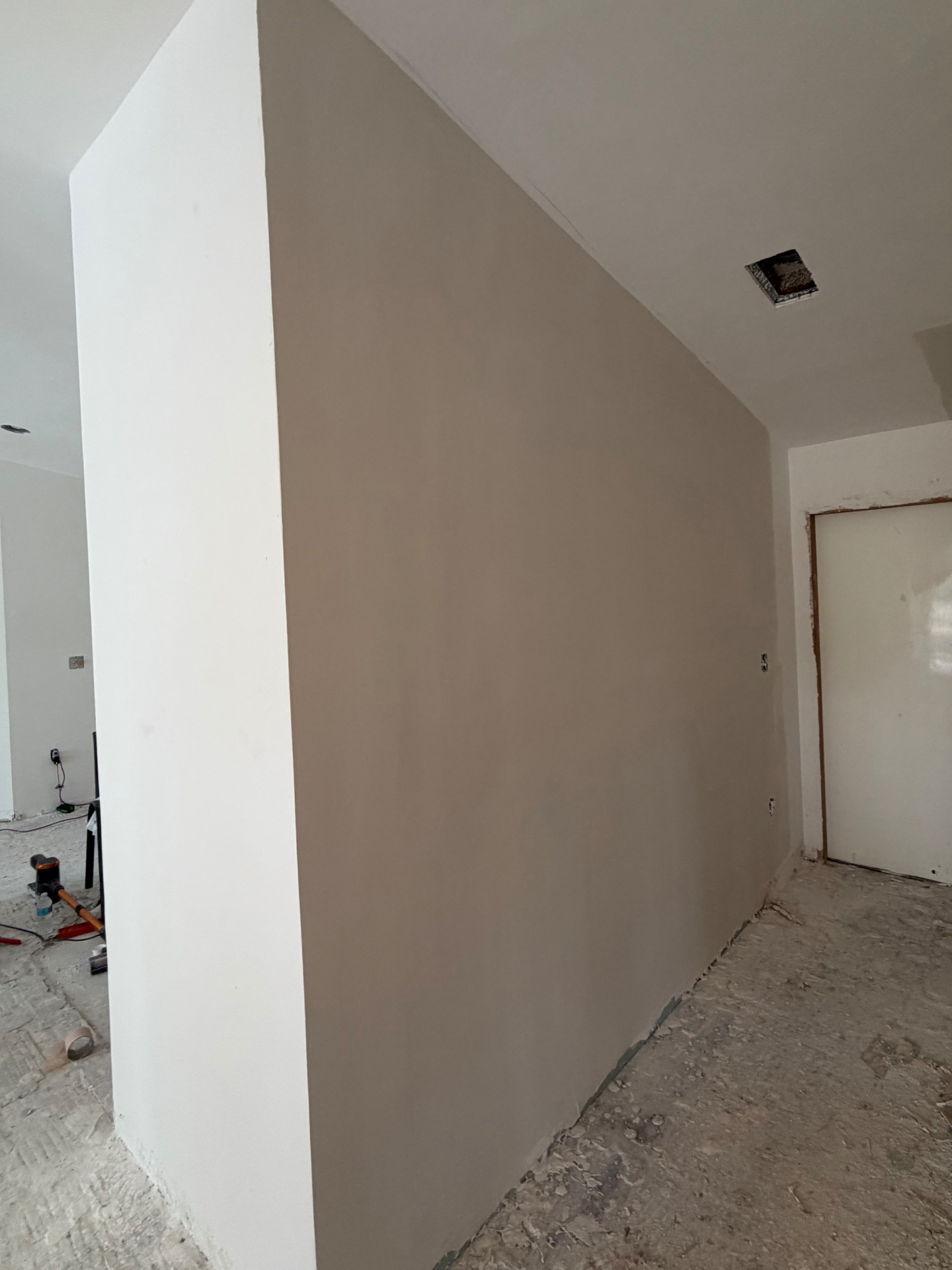 Same kitchen wall after skim coat with smooth uniform finish