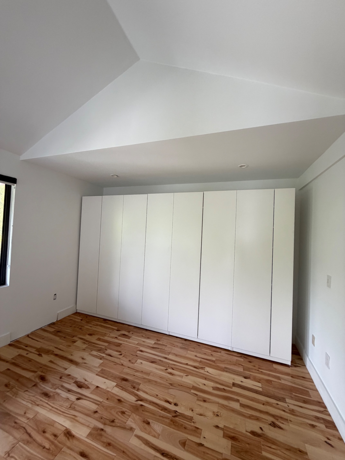 Finished room after put-back — insulation, drywall, plaster and paint complete